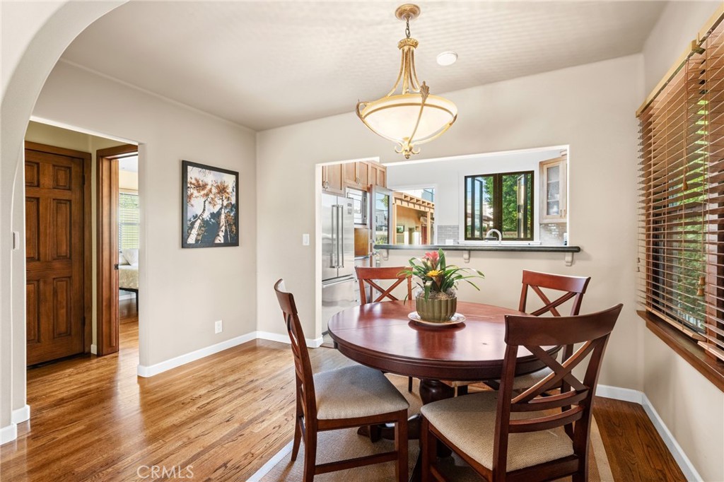 147 Trafalgar Lane San Clemente, CA 92672 - Photo 10 of 37 a view of a dining room with furniture wooden floor and chandelier