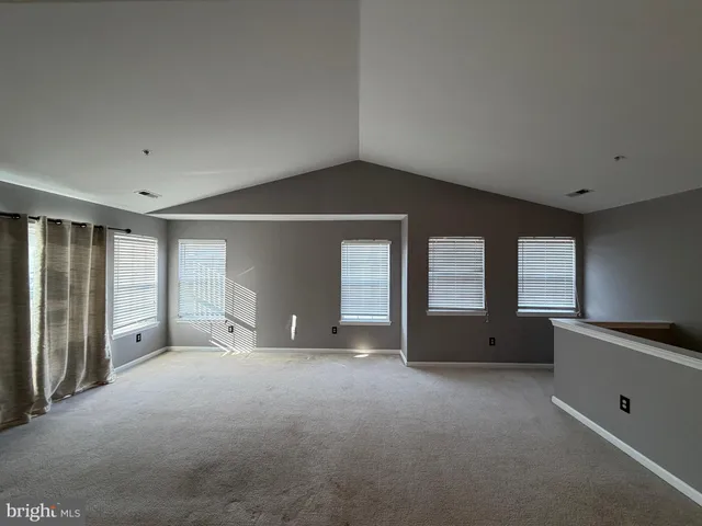 a view of balcony with furniture