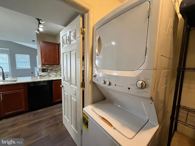 a kitchen with a refrigerator and a stove