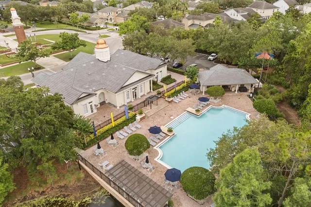 a view of a house with backyard porch and sitting area