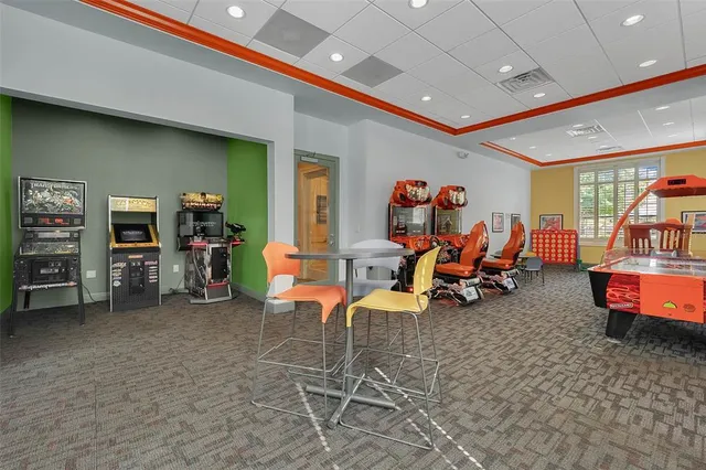 a front view of a house with a tree and a yard