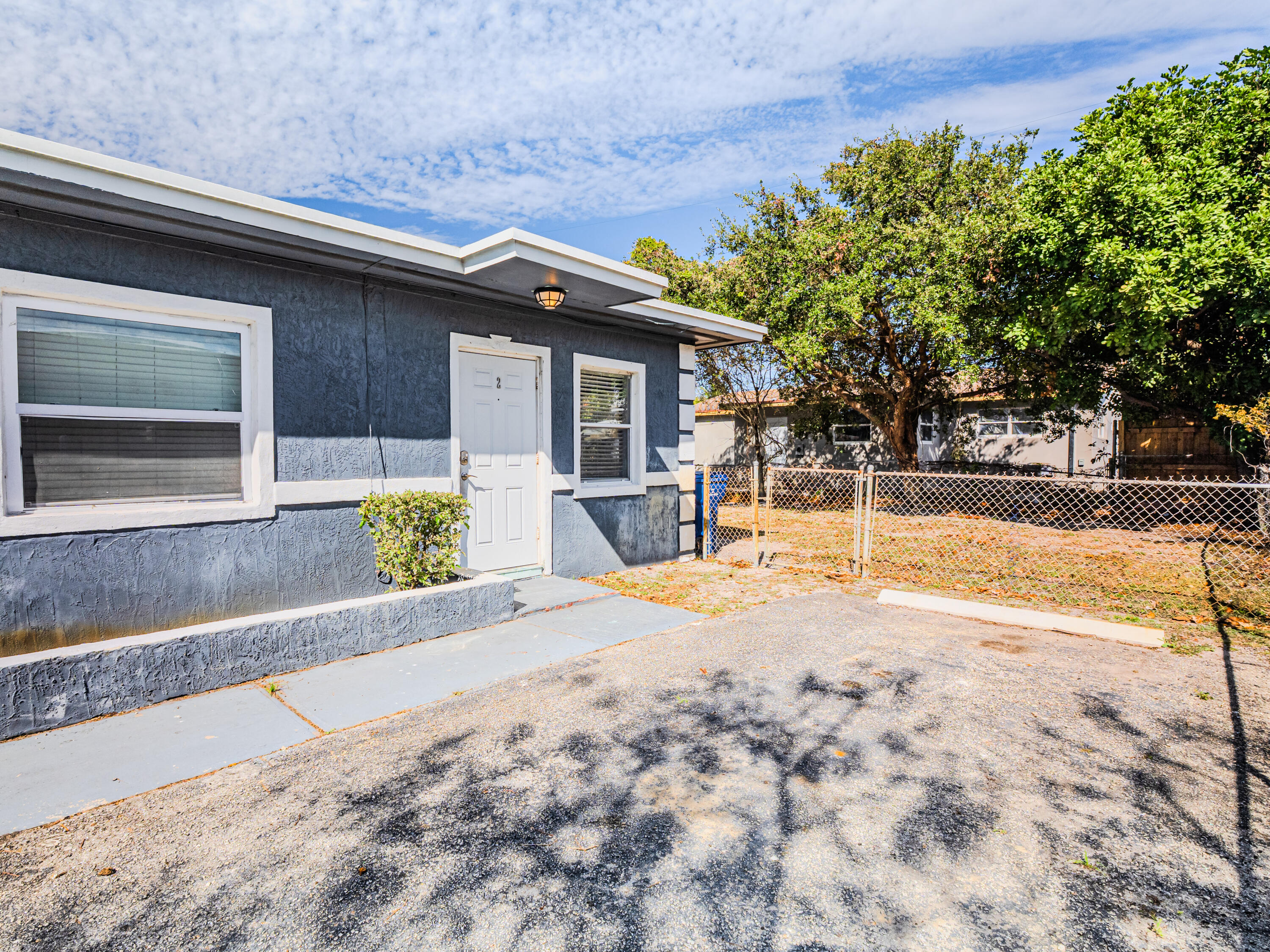 112 West 34th Street, Unit 1 Riviera Beach, FL 33404 - Photo 2 of 27 a house with a outdoor space