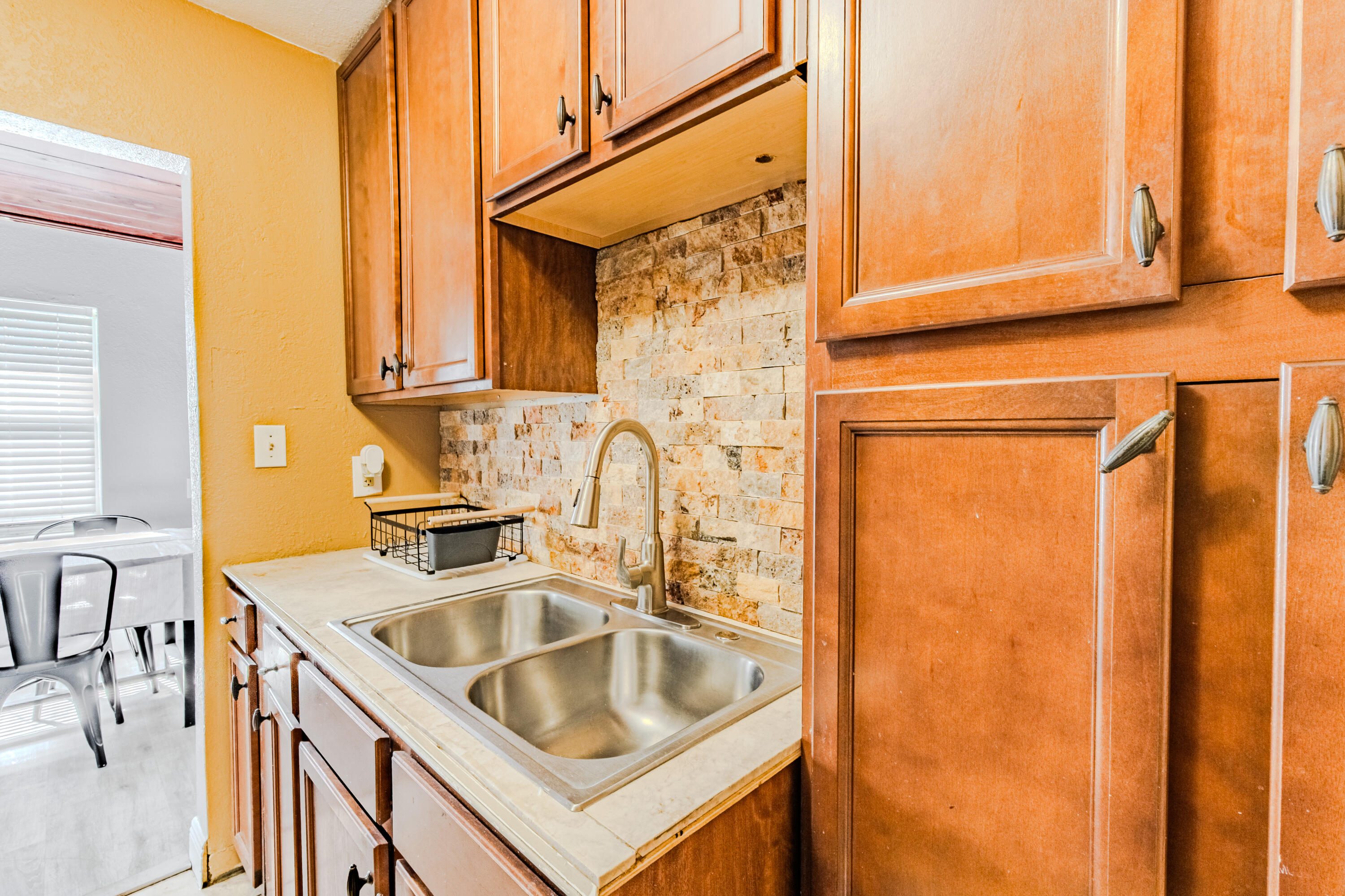 112 West 34th Street, Unit 1 Riviera Beach, FL 33404 - Photo 22 of 27 a kitchen that has a sink and a window