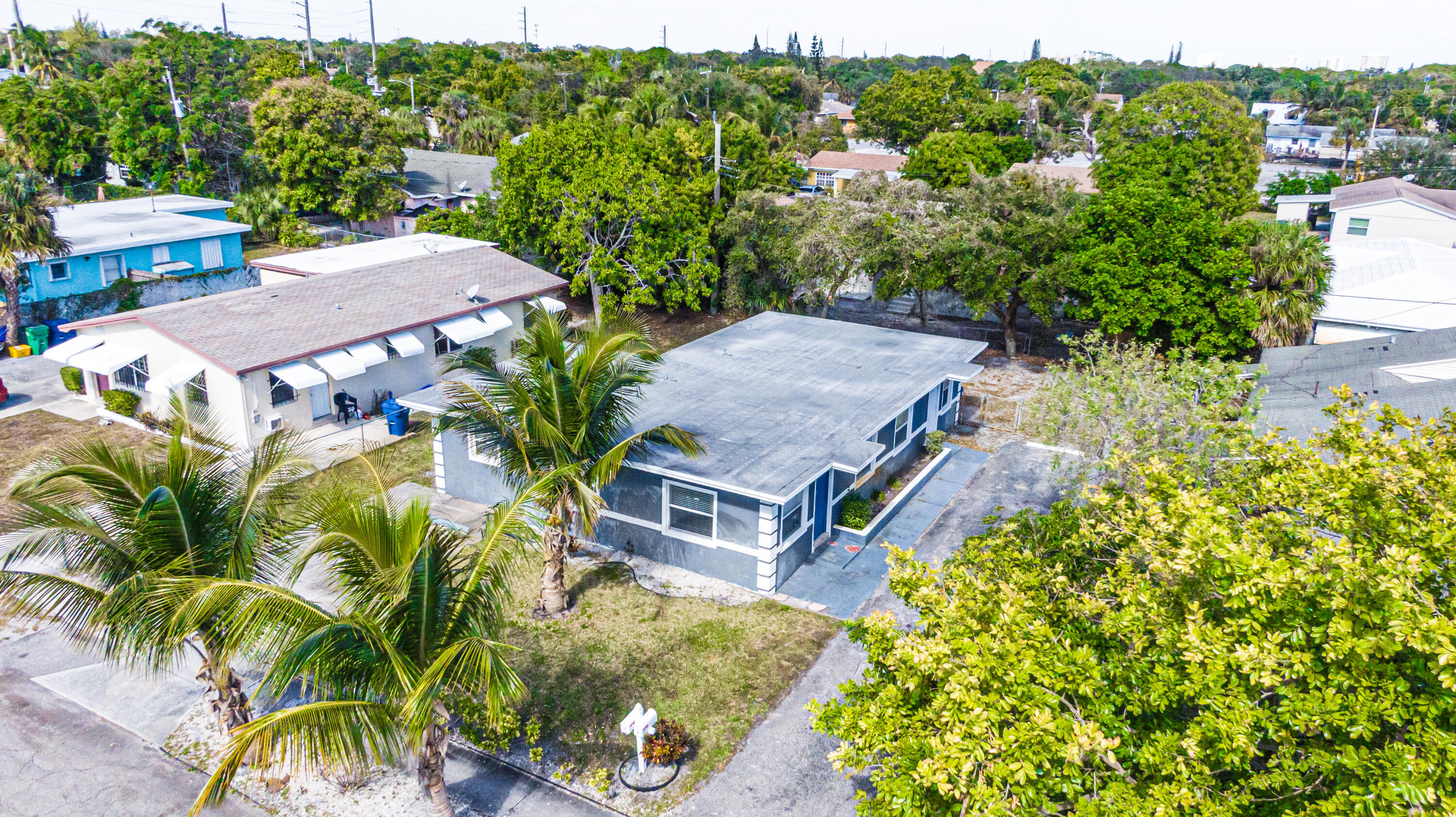 112 West 34th Street, Unit 1 Riviera Beach, FL 33404 - Photo 26 of 27 an aerial view of a house with a yard basket ball court and outdoor seating