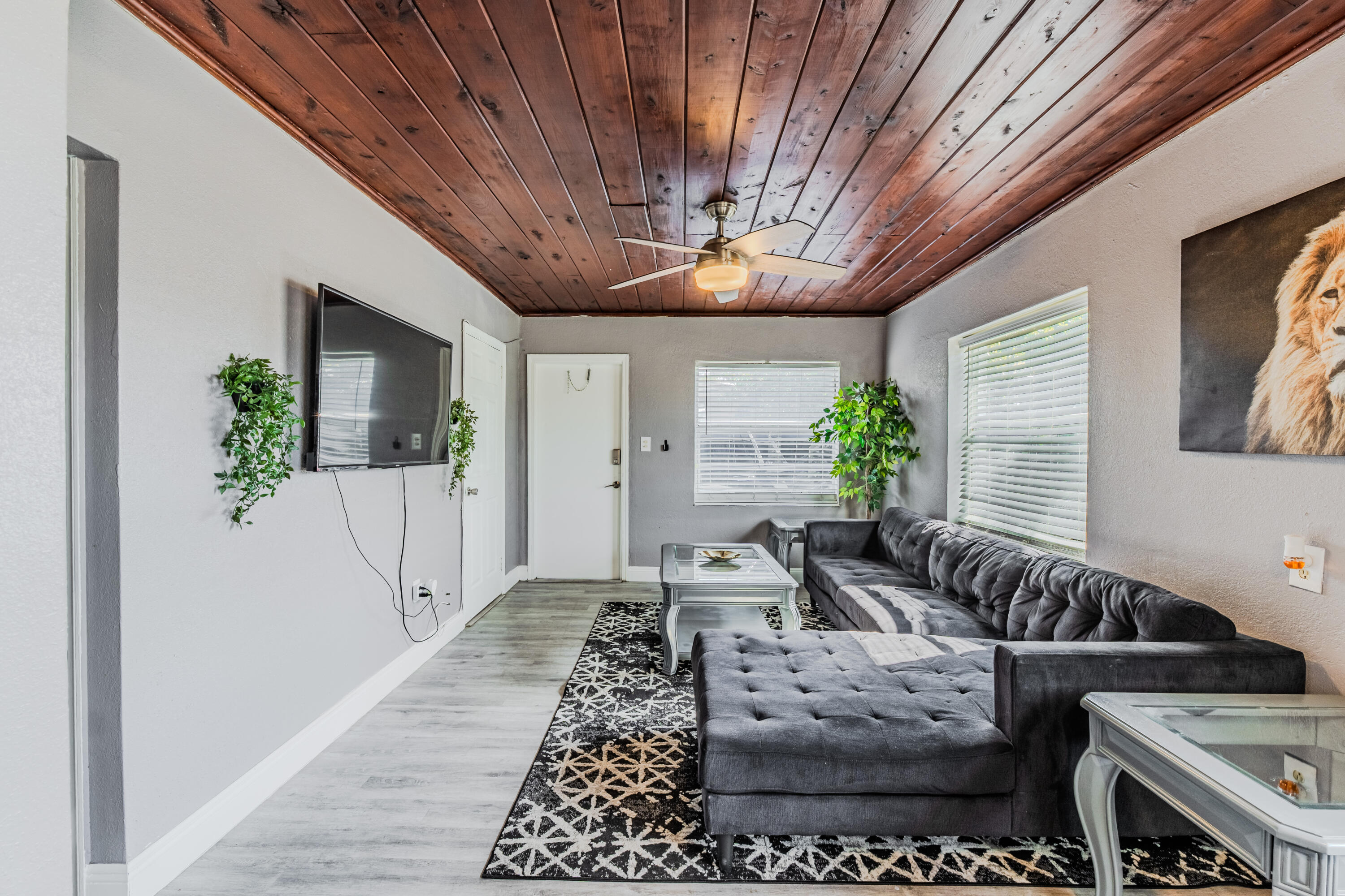 112 West 34th Street, Unit 1 Riviera Beach, FL 33404 - Photo 8 of 27 a living room with furniture and a chandelier