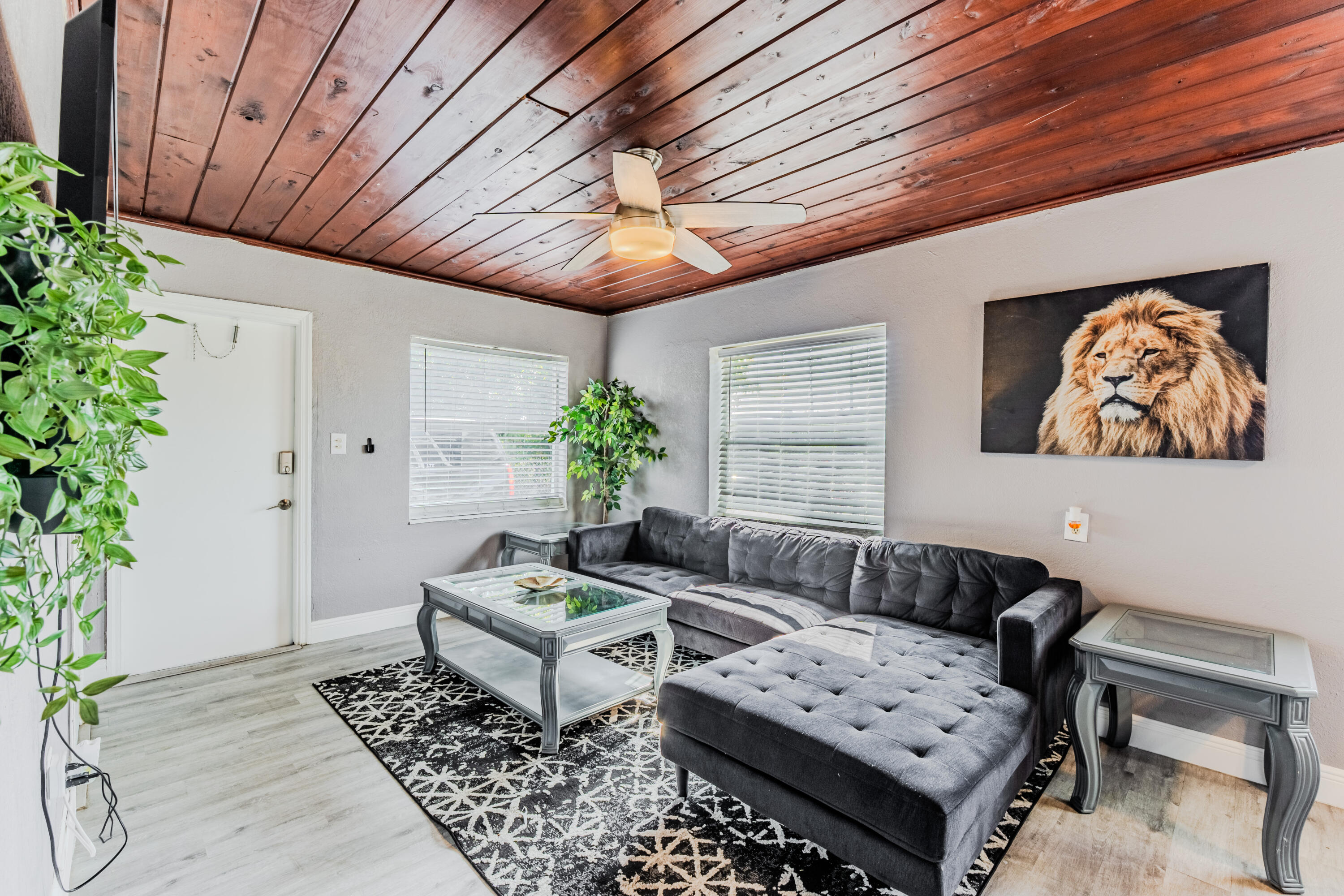 112 West 34th Street, Unit 1 Riviera Beach, FL 33404 - Photo 9 of 27 a living room with furniture and a potted plant