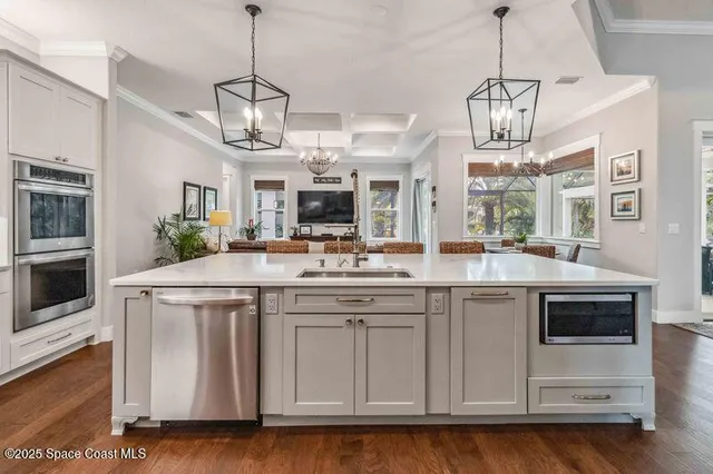 a bedroom with a bed table and a window