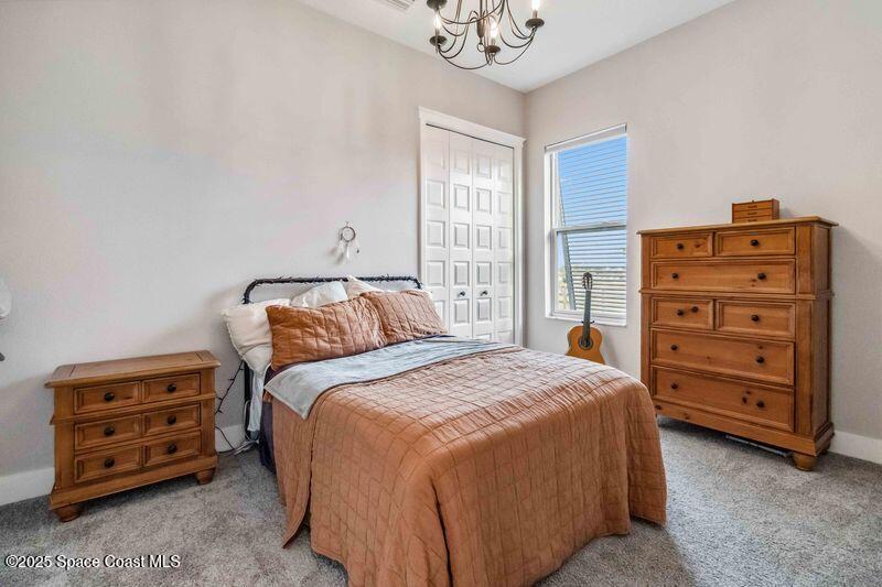 4620 Highway 1 Grant, FL 32949 - Photo 20 of 65 a bedroom with a bed and a dresser