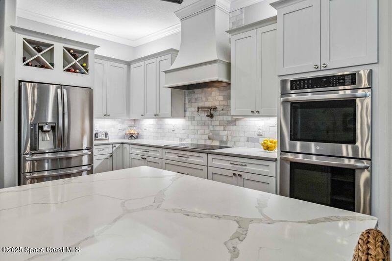 4620 Highway 1 Grant, FL 32949 - Photo 21 of 65 a kitchen with granite countertop a refrigerator stove and microwave