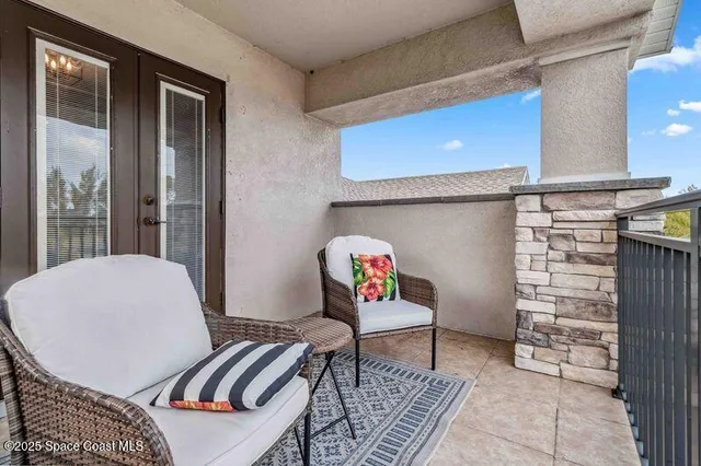 a bathroom with a granite countertop sink a toilet and a mirror