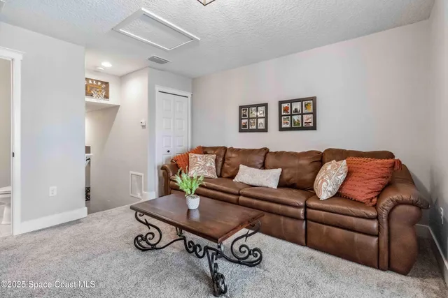 a view of swimming pool with outdoor seating