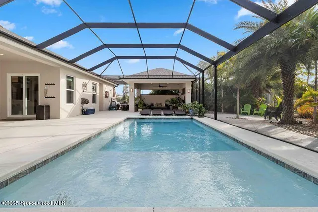a view of a livingroom with furniture and a window