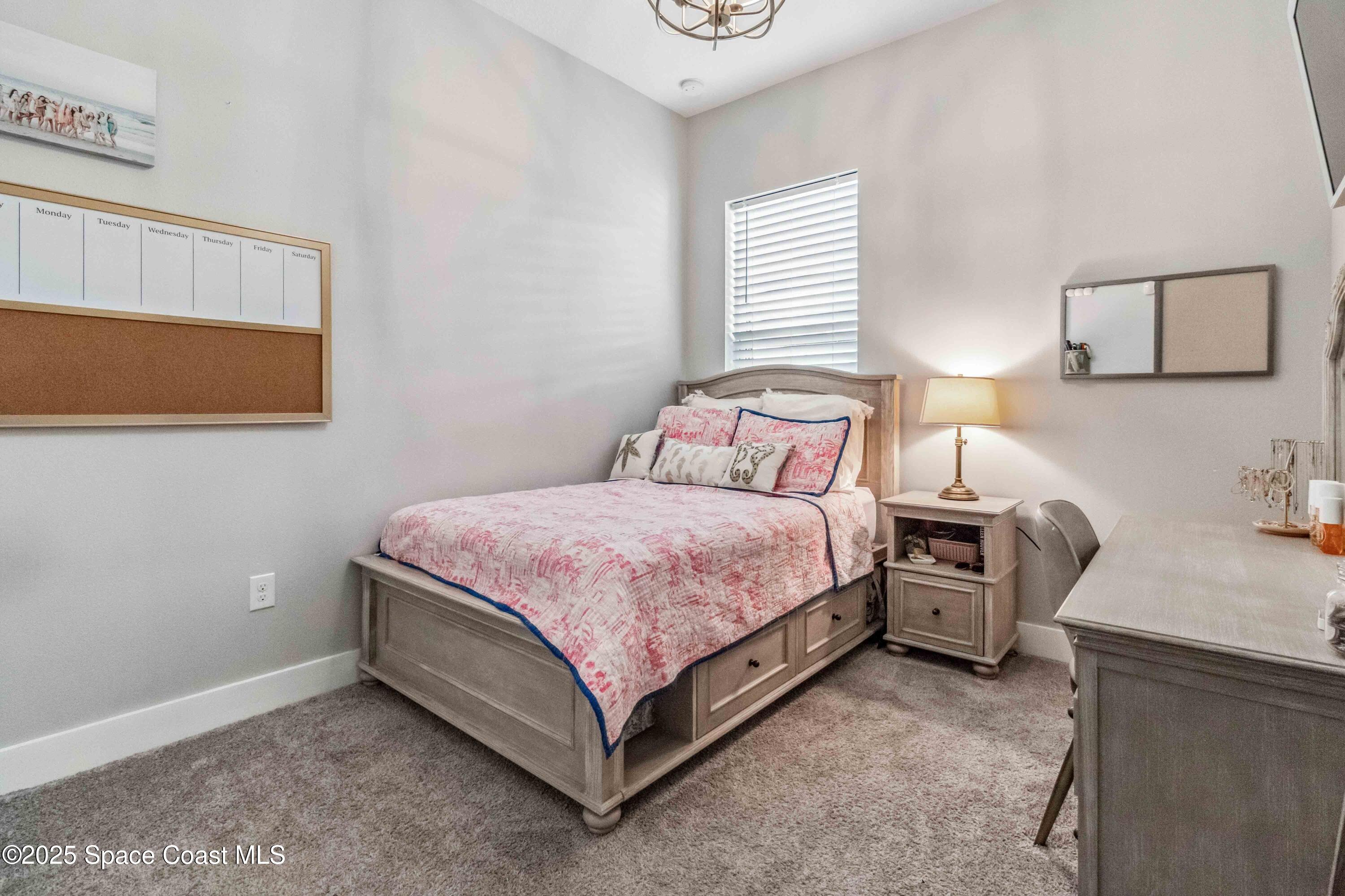 4620 Highway 1 Grant, FL 32949 - Photo 62 of 65 a bedroom with a bed and lamp