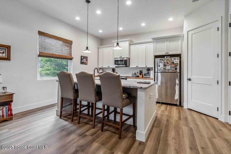 4620 Highway 1 Grant, FL 32949 - Photo 63 of 65 a view of a dining room with furniture window and wooden floor