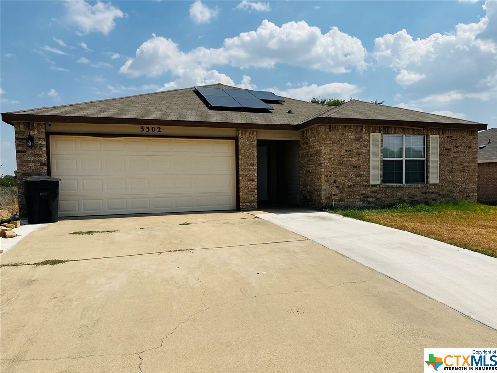 a front view of a house with a garage