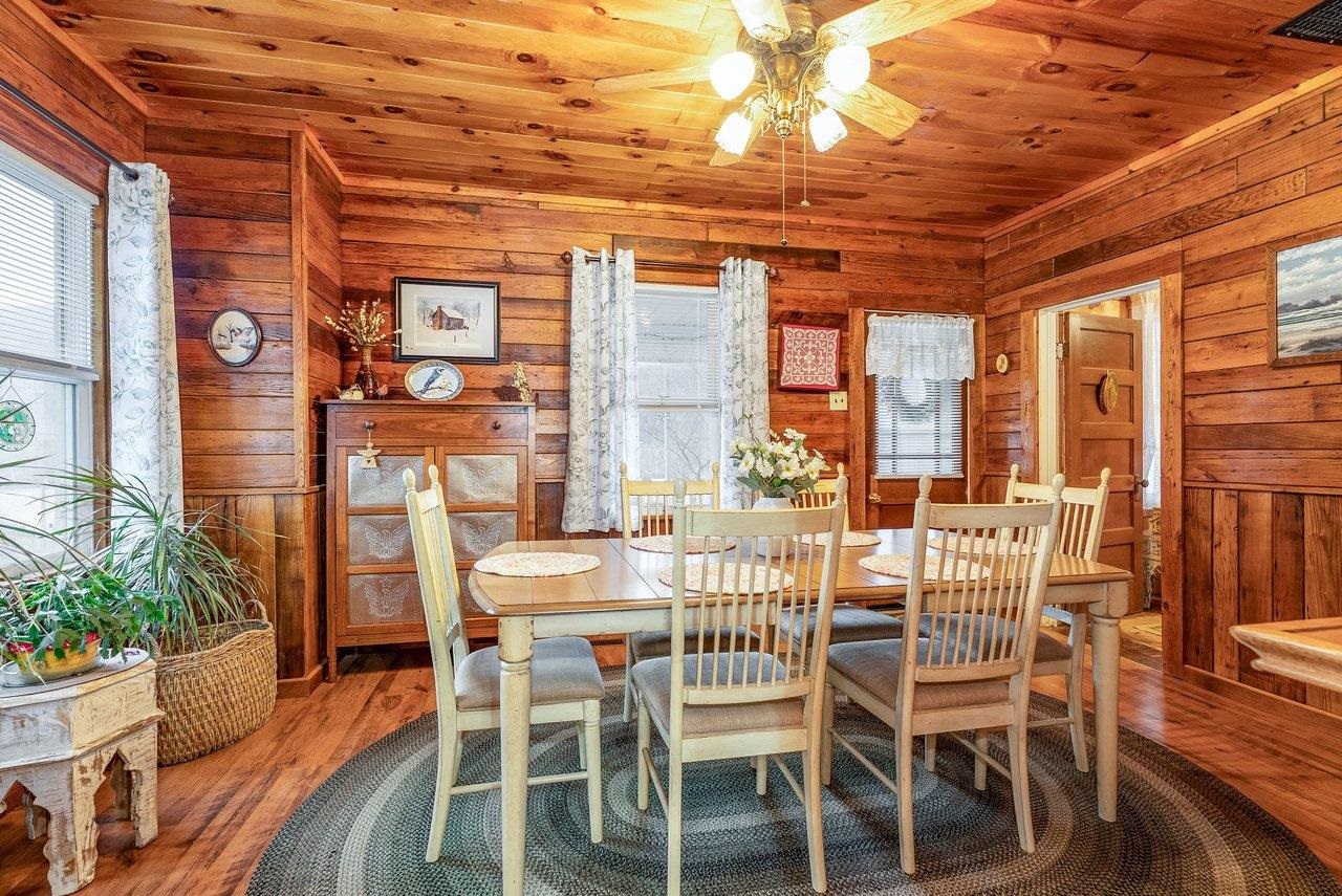 8545 Sugar Grove Road Sugar Grove, WV 26815 - Photo 19 of 75 a view of a dining room with furniture and wooden floor