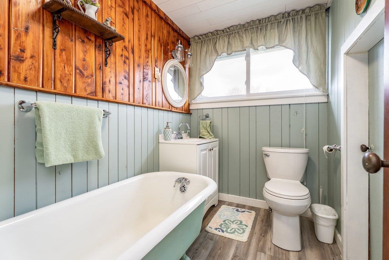 8545 Sugar Grove Road Sugar Grove, WV 26815 - Photo 49 of 75 a bathroom with a sink a toilet and a mirror