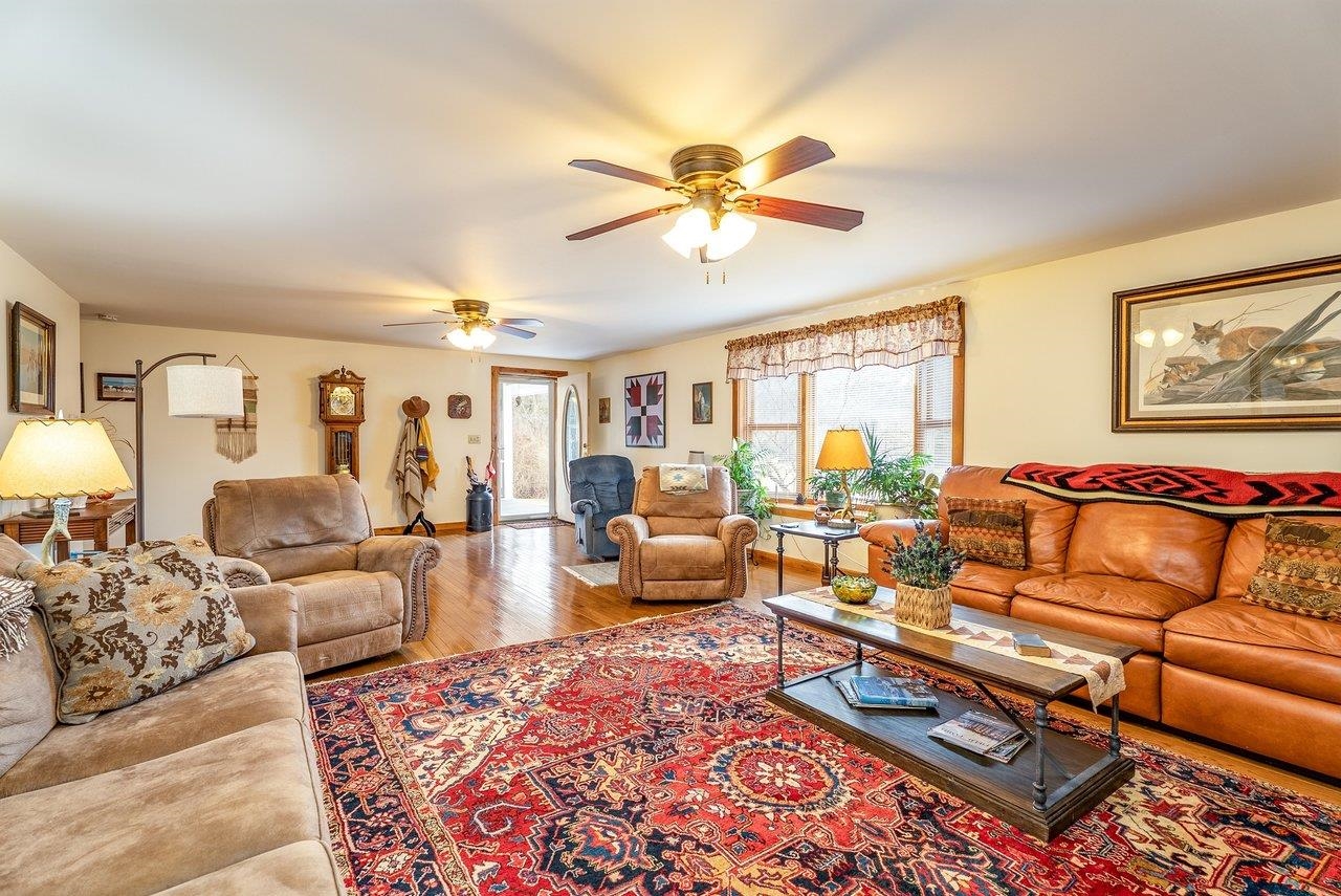 8545 Sugar Grove Road Sugar Grove, WV 26815 - Photo 5 of 75 a living room with furniture ceiling fan and a rug