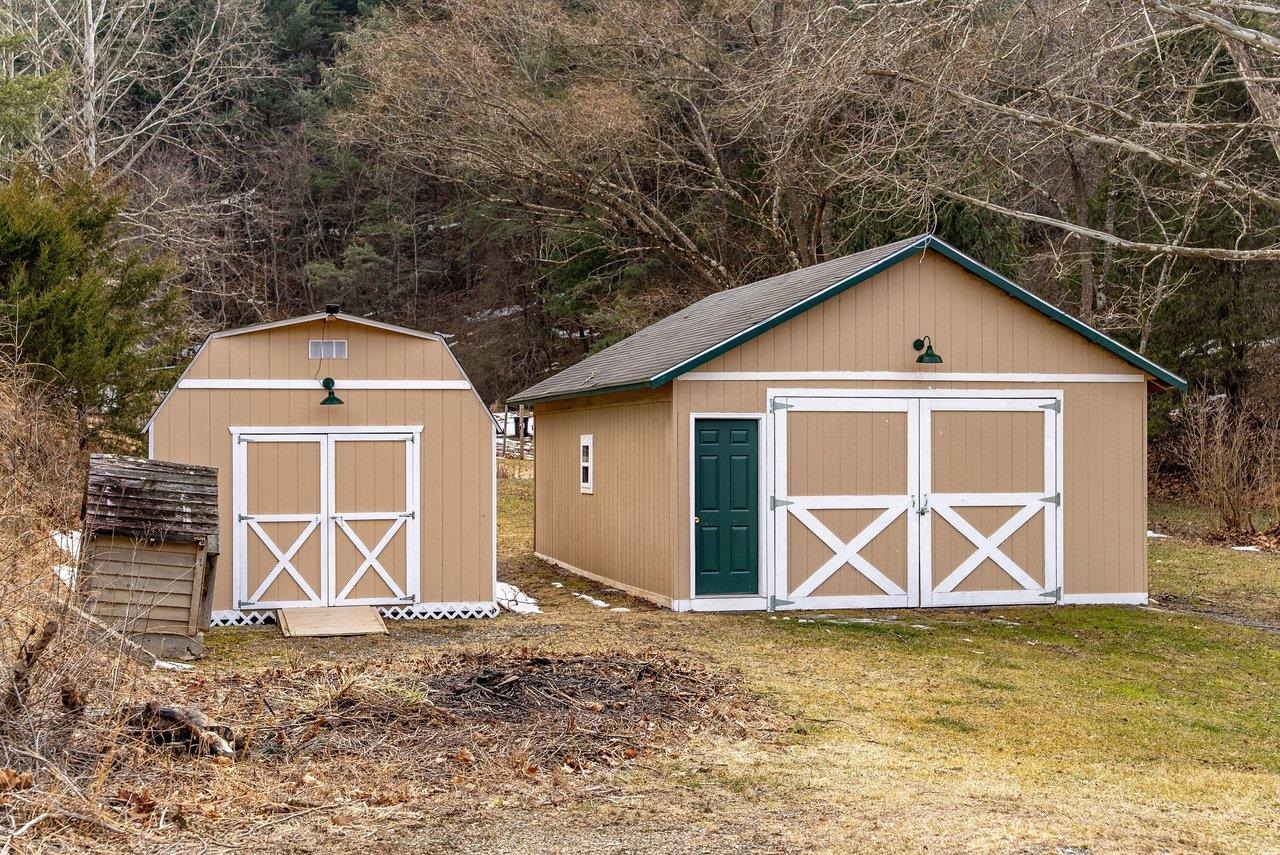 8545 Sugar Grove Road Sugar Grove, WV 26815 - Photo 71 of 75 a front view of a house with a yard and garage