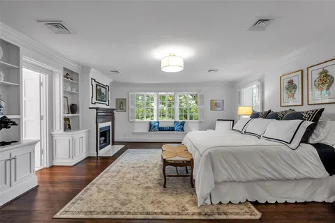 a bed room with a bed and a television