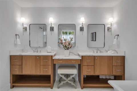 a bathroom with sink and mirror