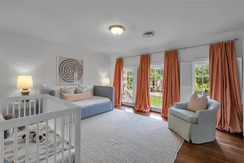 a spacious bedroom with a bed and a couch