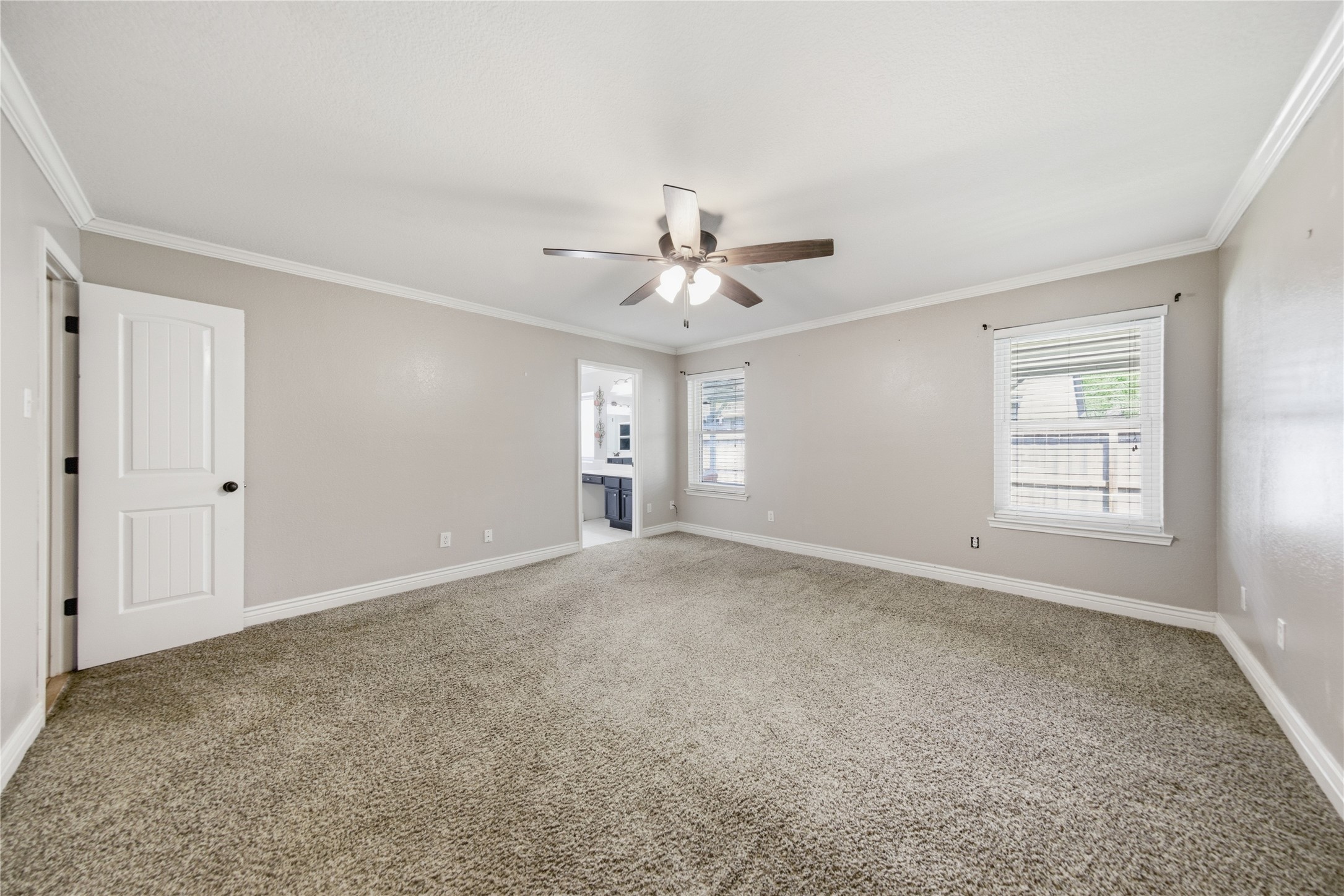 13506 Spring Court Tomball, TX 77375 - Photo 13 of 37 an empty room with windows and ceiling fan