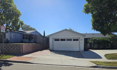a front view of a house with a garage
