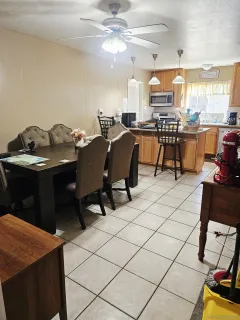 a kitchen with stainless steel appliances kitchen island granite countertop a sink and cabinets