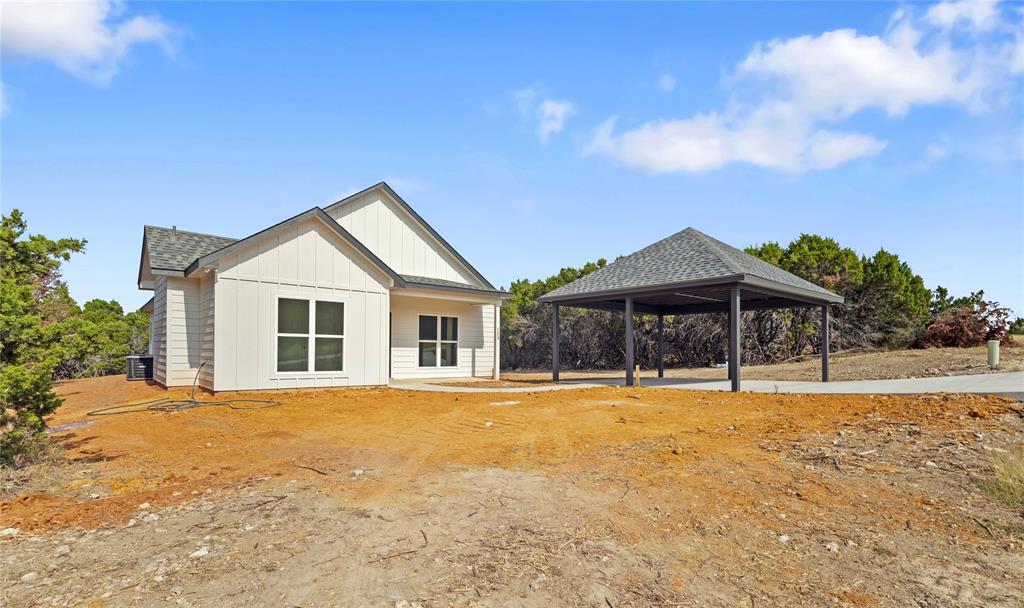 123 Cedar Shadow Lane Whitney, TX 76692 - Photo 1 of 27 a front view of a house with a yard
