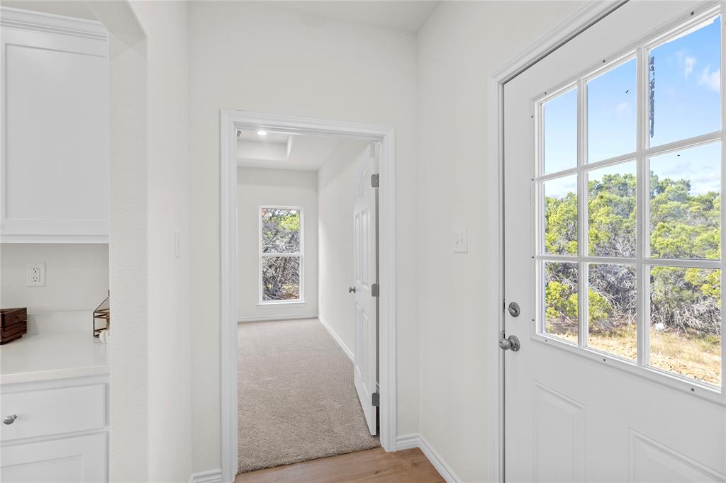 123 Cedar Shadow Lane Whitney, TX 76692 - Photo 12 of 27 a view of an entryway with wooden floor