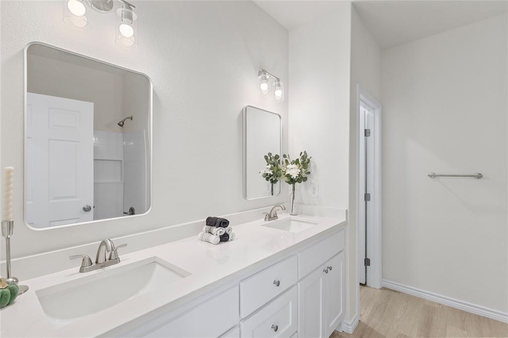 123 Cedar Shadow Lane Whitney, TX 76692 - Photo 15 of 27 a bathroom with a sink vanity and a mirror