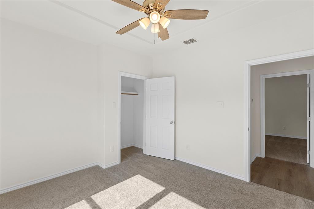 123 Cedar Shadow Lane Whitney, TX 76692 - Photo 20 of 27 a view of an empty room with a ceiling fan
