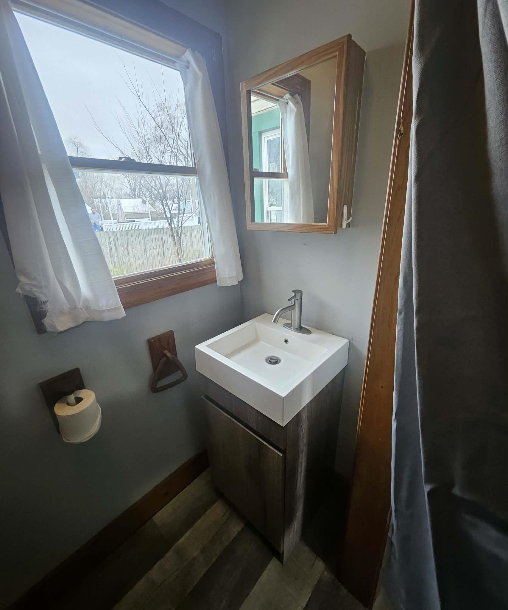 110 South 8th Street Beloit, WI 53511 - Photo 11 of 19 a bathroom with a sink a toilet and a window