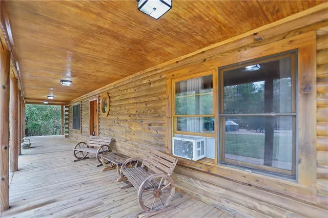 a living room with fireplace furniture and a fireplace