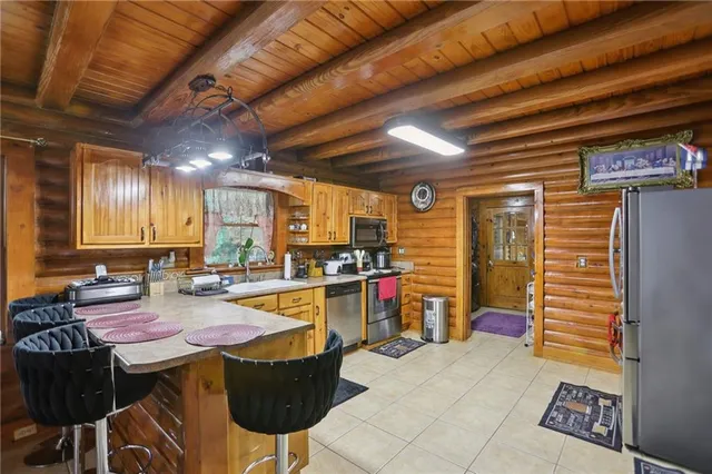 a view of a kitchen with a sink and cabinets