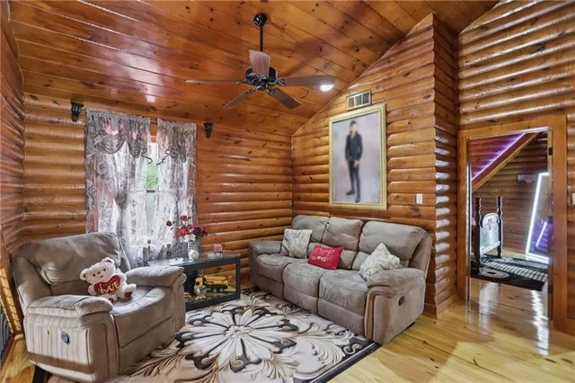 a bedroom with a bed and dresser with mirror