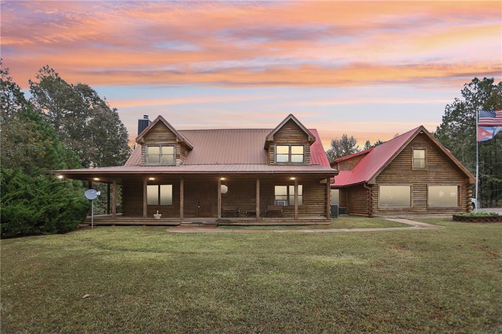 5467 Highway 162 Covington, GA 30016 - Photo 5 of 53 front view of a house with a yard