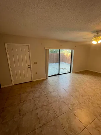 a view of an empty room with a window