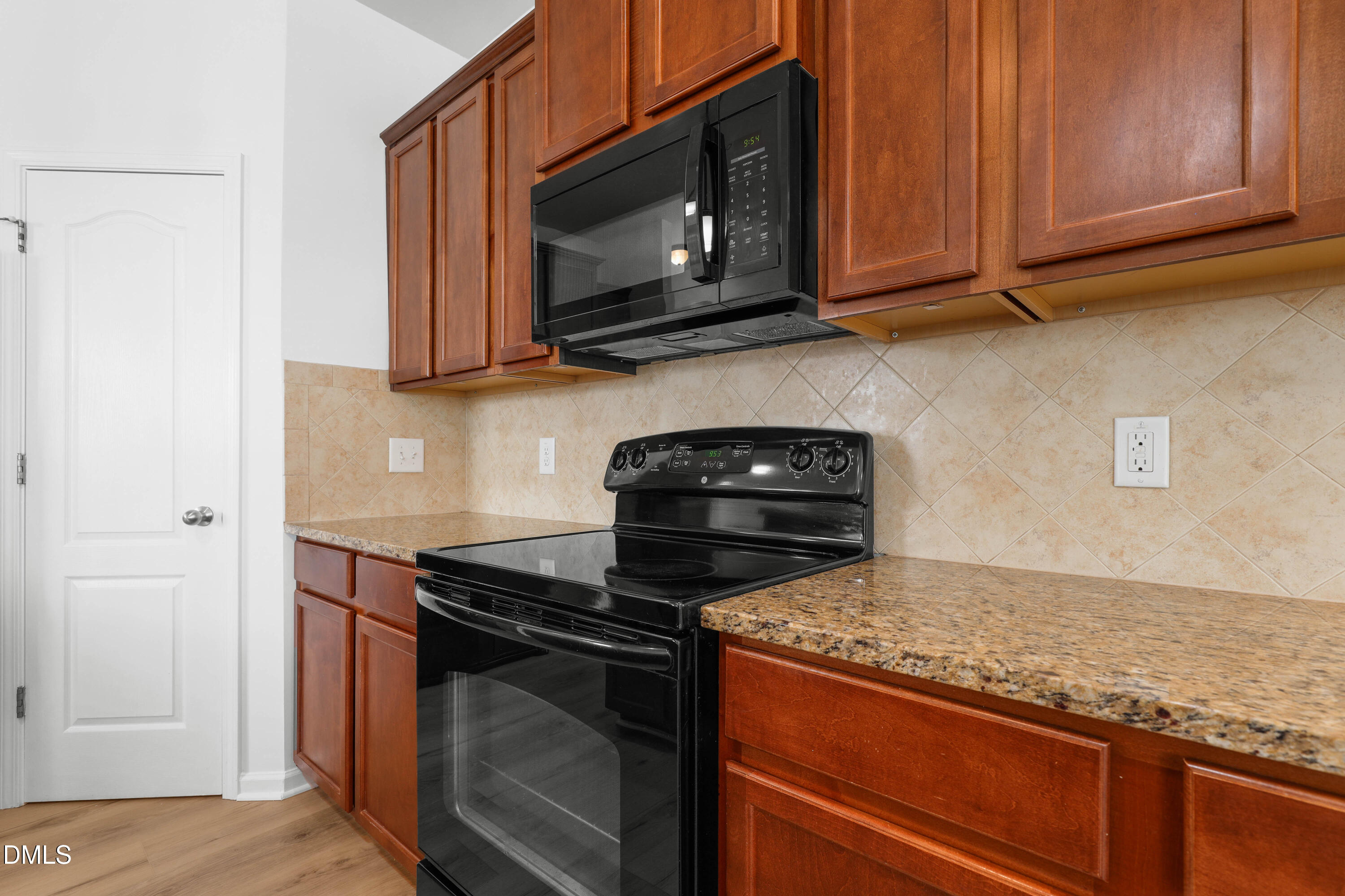 4400 Hillsgrove Road Wake Forest, NC 27587 - Photo 8 of 49 a kitchen with stainless steel appliances granite countertop a stove microwave and cabinets