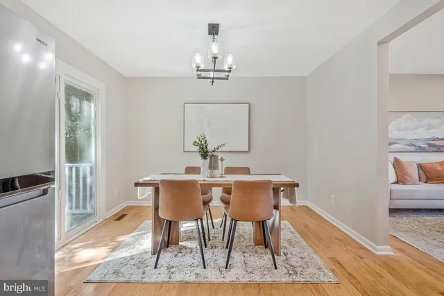 a kitchen with a refrigerator a stove top oven a sink and cabinets