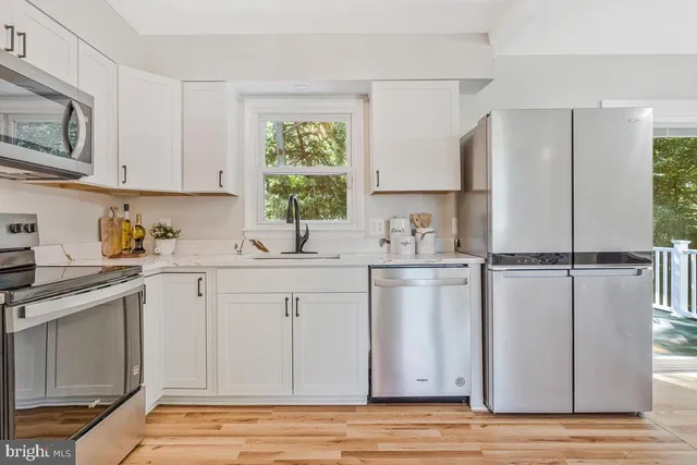 a kitchen with a sink and a window