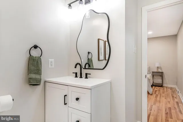a living room with furniture a fireplace and a large window