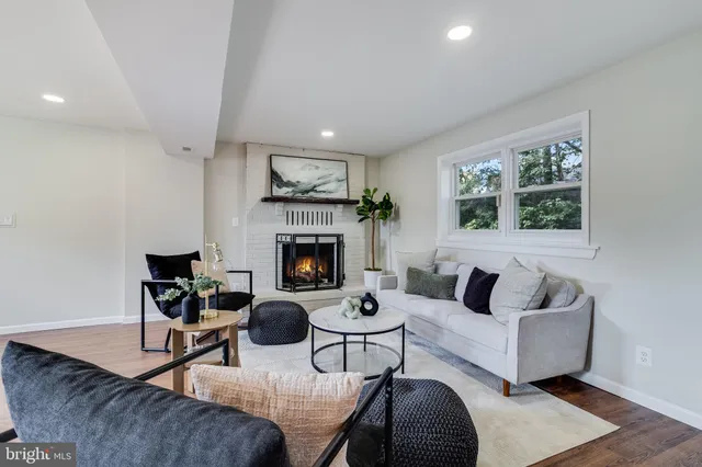 a view of a work space with furniture and wooden floor