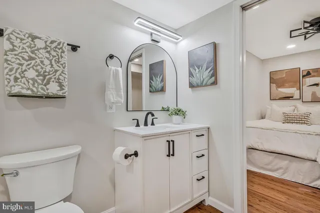 a view of a house with a yard and a tree