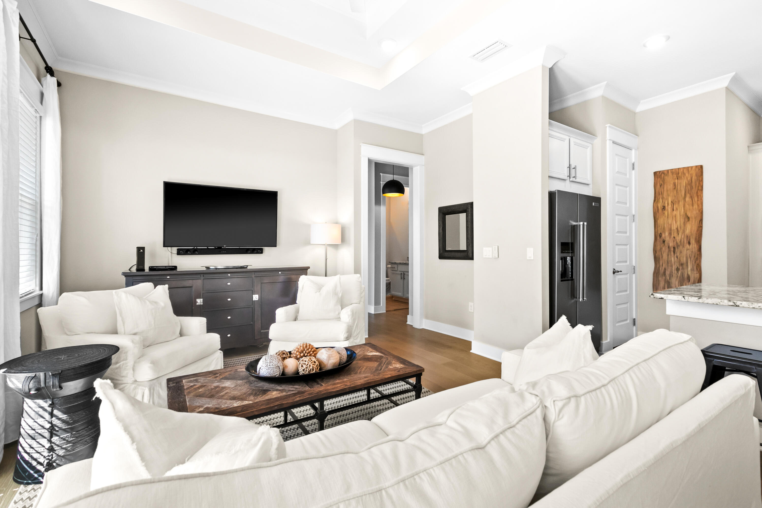 111 East Milestone Drive, Unit C Inlet Beach, FL 32461 - Photo 12 of 37 a living room with furniture and a flat screen tv