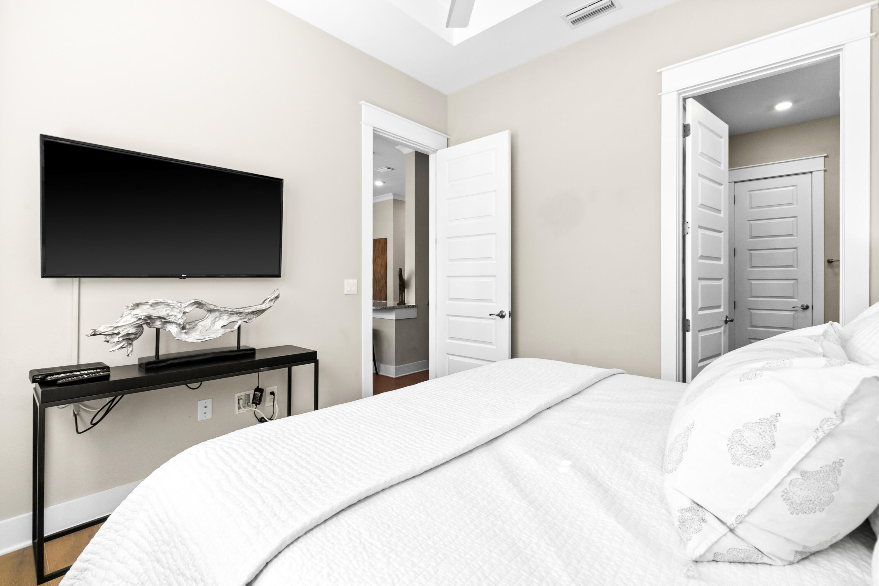 111 East Milestone Drive, Unit C Inlet Beach, FL 32461 - Photo 16 of 37 a bedroom with a bed and a flat screen tv