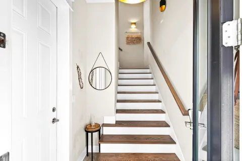 a view of a staircase with white walls