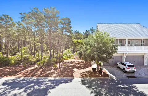 a view of a yard with a tree