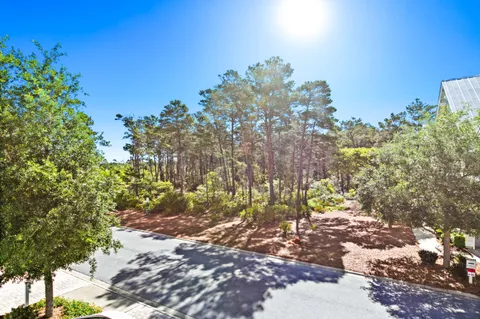 an aerial view of a swimming pool with outdoor seating